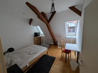 Ein Bett oder Betten in einem Zimmer der Unterkunft Ferienwohnung Kitzenmarkt