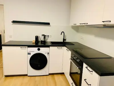 Küche/Küchenzeile in der Unterkunft Modernes 1 Zimmer Appartement direkt am Wörthsee