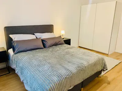 Ein Bett oder Betten in einem Zimmer der Unterkunft Modernes 1 Zimmer Appartement direkt am Wörthsee