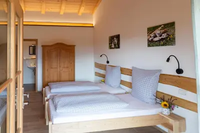 Ein Bett oder Betten in einem Zimmer der Unterkunft Kaffeekandl Café & Pension