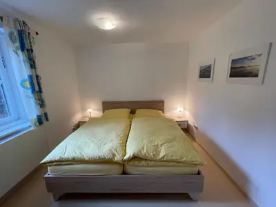 Ein Bett oder Betten in einem Zimmer der Unterkunft Ferienwohnung Maslanka EG