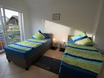 Ein Bett oder Betten in einem Zimmer der Unterkunft Ferienwohnung Monika