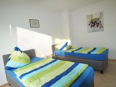 Ein Bett oder Betten in einem Zimmer der Unterkunft Ferienwohnung Monika