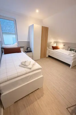 Ein Bett oder Betten in einem Zimmer der Unterkunft Hotel Aqua