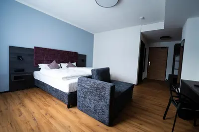 Ein Bett oder Betten in einem Zimmer der Unterkunft PEN Smart Hotel