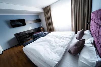 Ein Bett oder Betten in einem Zimmer der Unterkunft PEN Smart Hotel