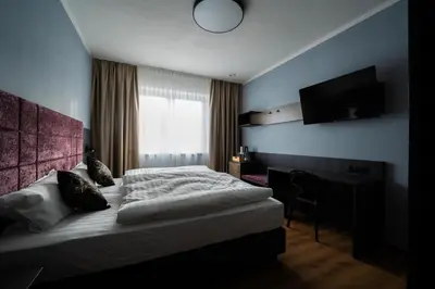 Ein Bett oder Betten in einem Zimmer der Unterkunft PEN Smart Hotel