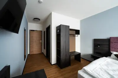 Ein Bett oder Betten in einem Zimmer der Unterkunft PEN Smart Hotel