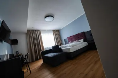 Ein Bett oder Betten in einem Zimmer der Unterkunft PEN Smart Hotel