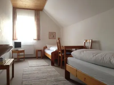 Ein Bett oder Betten in einem Zimmer der Unterkunft PensionSchilling