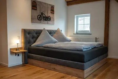 Ein Bett oder Betten in einem Zimmer der Unterkunft Ferienwohnung Demmelbach