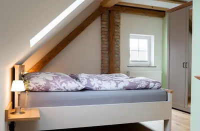 Ein Bett oder Betten in einem Zimmer der Unterkunft Ferienwohnung Demmelbach
