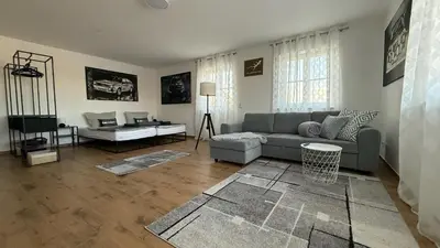 Ein Sitzbereich in der Unterkunft modern & spacious Apartments CarHandling Campus -Nähe Therme Erding -Messe München -Arena -free parking -Netflix -W-LAN
