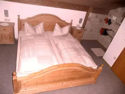 Ein Bett oder Betten in einem Zimmer der Unterkunft Apartment Dachgeschosswohnung mit toller Aussicht vom Balkon by Interhome