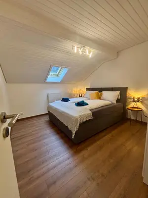 Ein Bett oder Betten in einem Zimmer der Unterkunft Ruhig gelegene Ferienwohnung am Waldrand