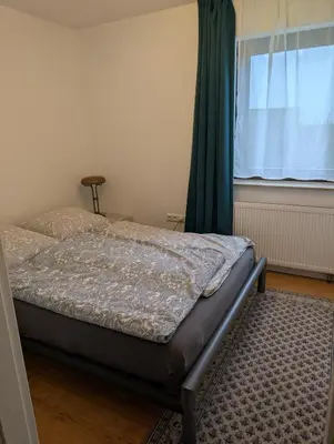 Ein Bett oder Betten in einem Zimmer der Unterkunft Ferienwohnung mit Terrasse in der Nähe vom Golfplatz