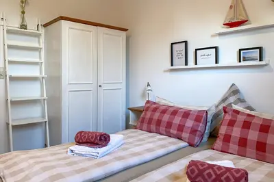 Ein Bett oder Betten in einem Zimmer der Unterkunft Chiemsee Blick