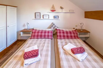 Ein Bett oder Betten in einem Zimmer der Unterkunft Chiemsee Blick