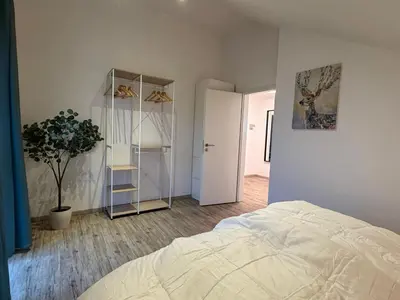 Ein Bett oder Betten in einem Zimmer der Unterkunft Perfekt für 2-4! Küche Garage Flughafen Nespresso