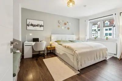 Ein Bett oder Betten in einem Zimmer der Unterkunft NEW Proud Stay Augsburg Historisches Viertel