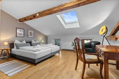 Ein Bett oder Betten in einem Zimmer der Unterkunft Design Apartment No 3 Gmund am Tegernsee by BALANCED