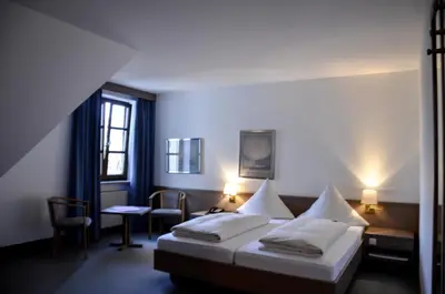 Ein Bett oder Betten in einem Zimmer der Unterkunft Hotel Rössle