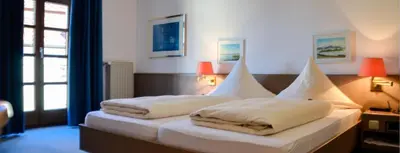 Ein Bett oder Betten in einem Zimmer der Unterkunft Hotel Rössle
