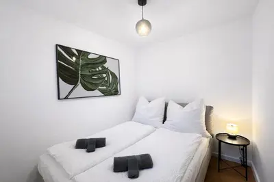 Ein Bett oder Betten in einem Zimmer der Unterkunft Stilvolles Studio für bis zu 6 Gäste - Balkon & Parkplatz