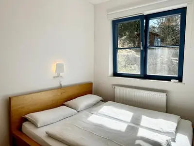 Ein Bett oder Betten in einem Zimmer der Unterkunft Ein Haus am Berg
