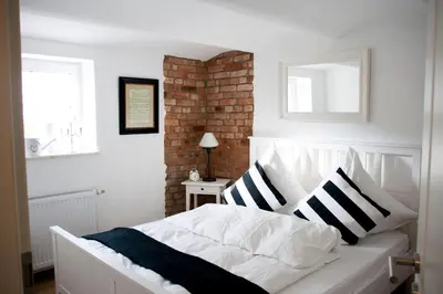 Ein Bett oder Betten in einem Zimmer der Unterkunft Ilmhaus