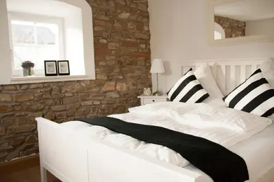 Ein Bett oder Betten in einem Zimmer der Unterkunft Ilmhaus