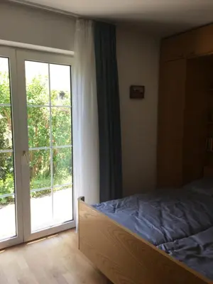 Ein Bett oder Betten in einem Zimmer der Unterkunft Perfekte Verbindung zur Messe