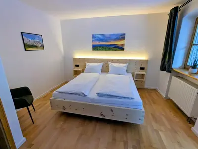 Ein Bett oder Betten in einem Zimmer der Unterkunft Geigerhof Bad Heilbrunn