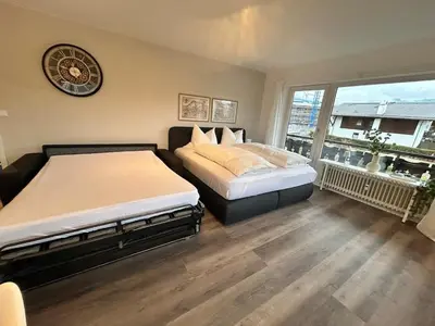 Ein Bett oder Betten in einem Zimmer der Unterkunft Gipfelbussi
