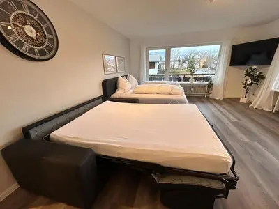 Ein Bett oder Betten in einem Zimmer der Unterkunft Gipfelbussi
