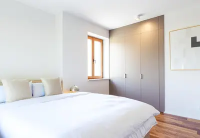 Ein Bett oder Betten in einem Zimmer der Unterkunft TrulySpace - Modernes Apartment am Rathausplatz, Terrasse, Fahrstuhl
