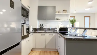 Küche/Küchenzeile in der Unterkunft TrulySpace - Modernes Apartment am Rathausplatz, Terrasse, Fahrstuhl