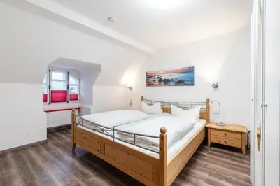 Ein Bett oder Betten in einem Zimmer der Unterkunft Ferienwohnungen Ammerwinkel