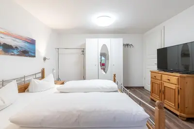 Ein Bett oder Betten in einem Zimmer der Unterkunft Ferienwohnungen Ammerwinkel