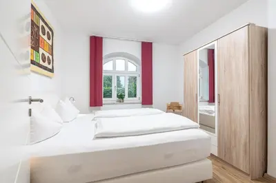 Ein Bett oder Betten in einem Zimmer der Unterkunft Ferienwohnungen Ammerwinkel