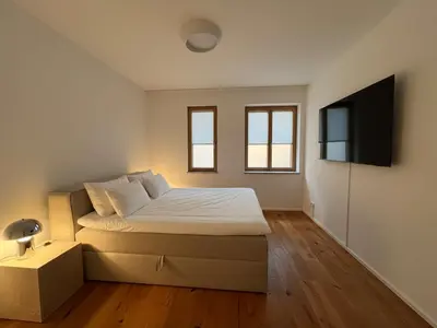 Ein Bett oder Betten in einem Zimmer der Unterkunft Rarität am Rathaus • Terrasse • Parken • 6 Gäste