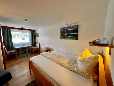 Ein Bett oder Betten in einem Zimmer der Unterkunft Hotel Fischerstüberl am See