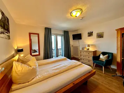 Ein Bett oder Betten in einem Zimmer der Unterkunft Hotel Fischerstüberl am See