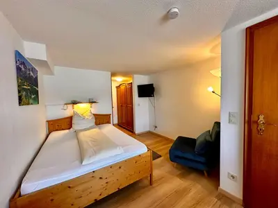 Ein Bett oder Betten in einem Zimmer der Unterkunft Hotel Fischerstüberl am See