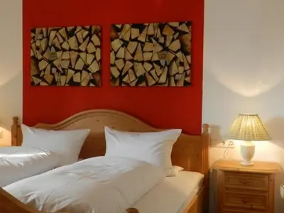 Ein Bett oder Betten in einem Zimmer der Unterkunft Landhaus Regina