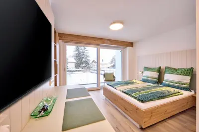 Ein Bett oder Betten in einem Zimmer der Unterkunft Starnberger See Apartments