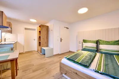 Ein Bett oder Betten in einem Zimmer der Unterkunft Starnberger See Apartments