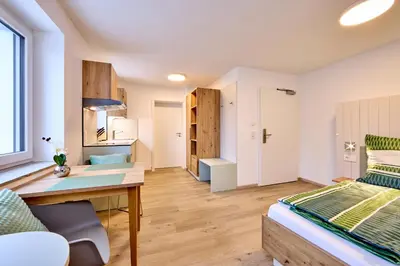 Ein Bett oder Betten in einem Zimmer der Unterkunft Starnberger See Apartments