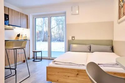 Ein Bett oder Betten in einem Zimmer der Unterkunft Starnberger See Apartments