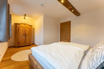 Ein Bett oder Betten in einem Zimmer der Unterkunft Fischerhof Samerberg - Auszeit mit Bergblick & Balkon